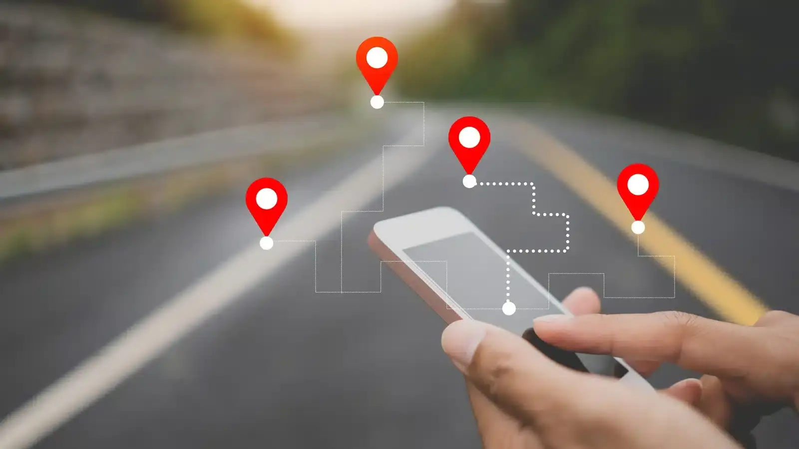 A hand holding a smartphone with map location pins, representing the Google Maps local pack where aesthetic clinics compete for the top three spots.
