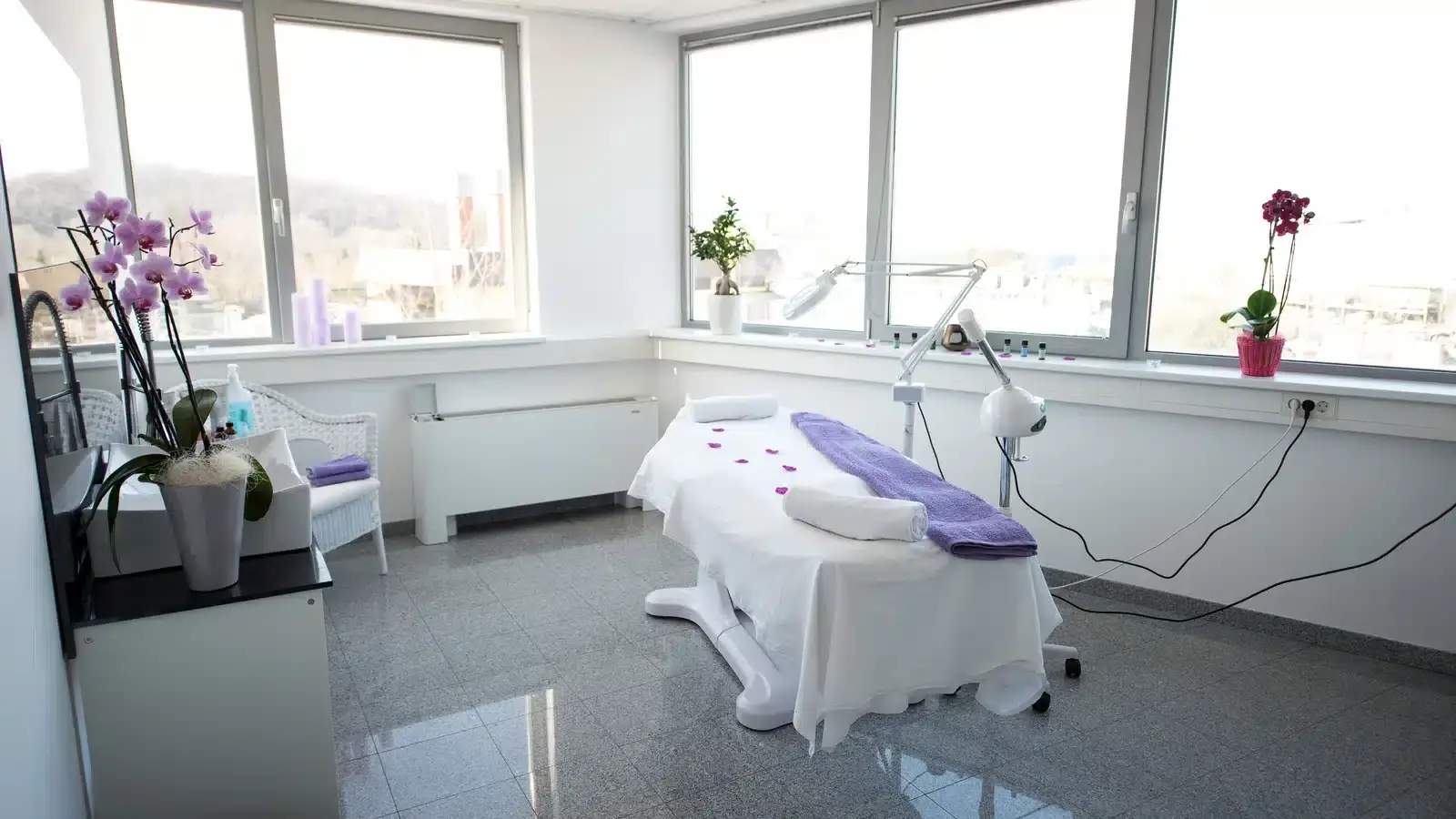 A bright, modern med spa treatment room, representing the real practice whose reviews and results build its local search authority.