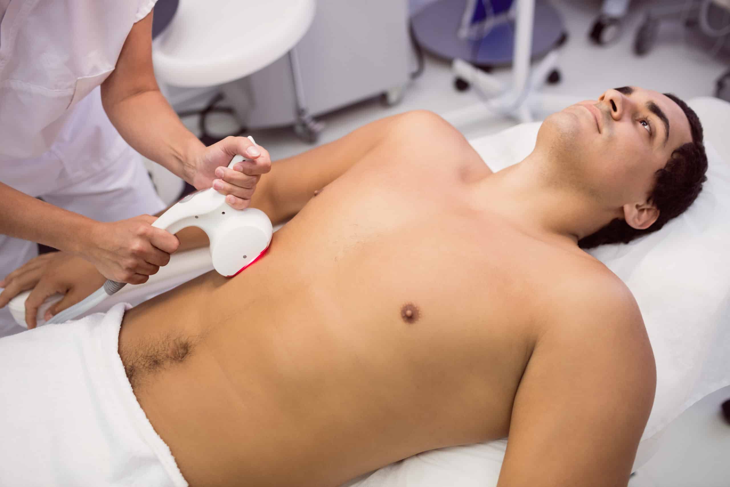 Tampa men's aesthetic clinic SEO — male patient receiving laser hair removal