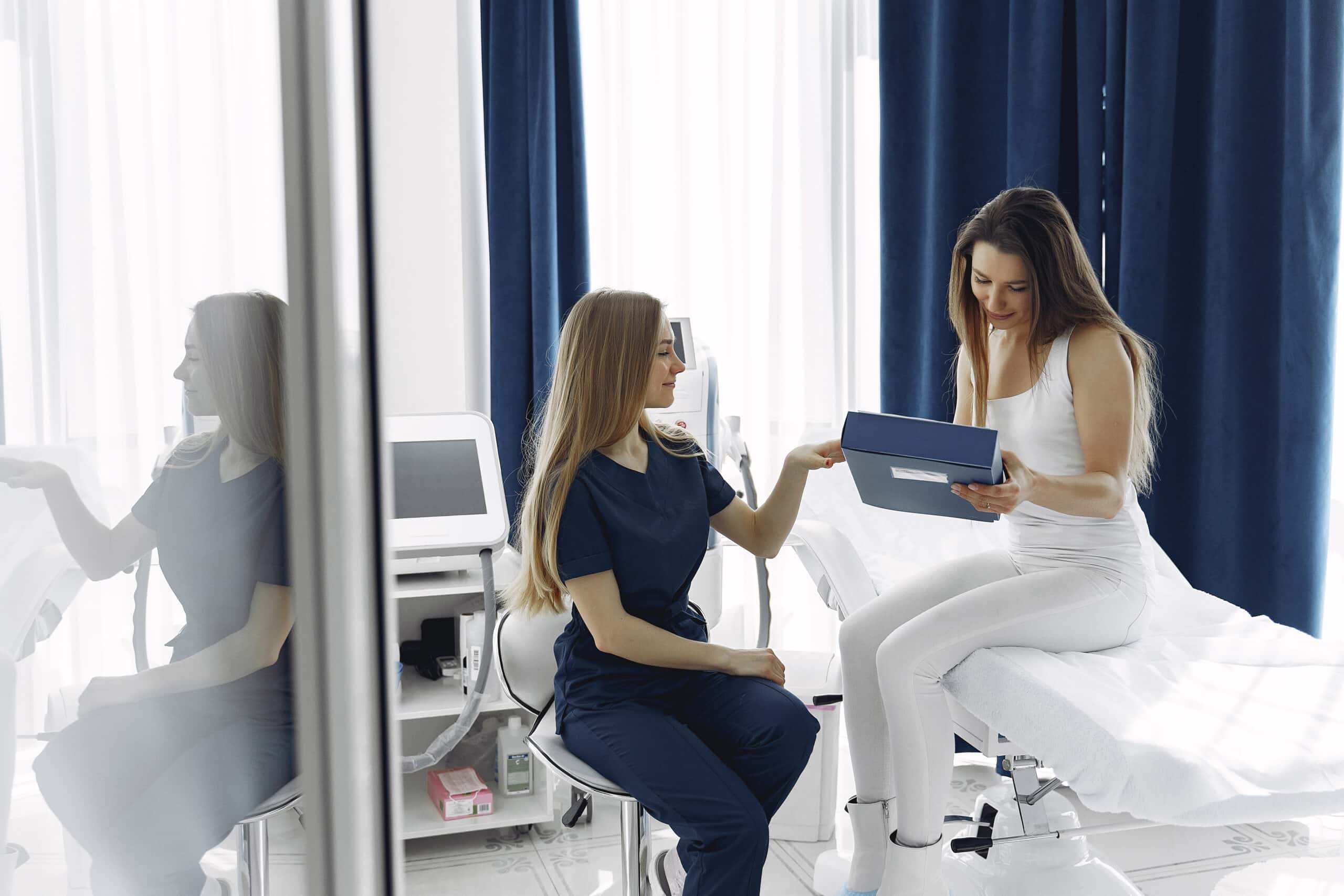 A Tampa med spa provider consulting with a patient about an aesthetic treatment