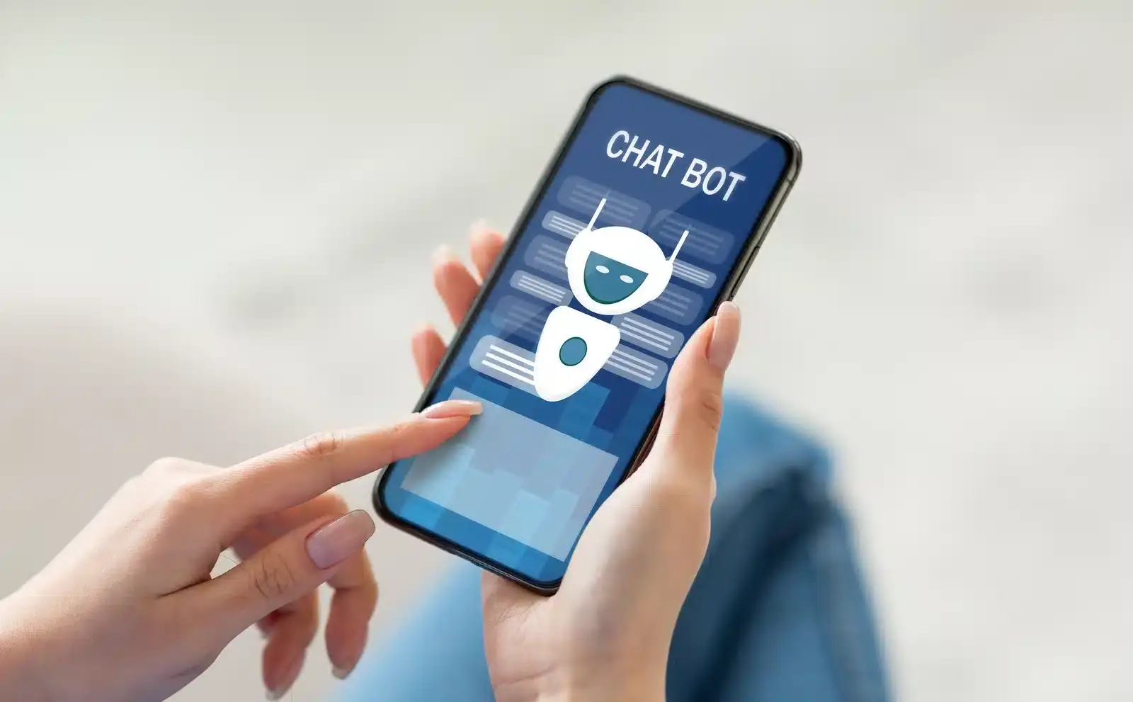 A person's hands using an AI chatbot on a smartphone, illustrating how patients use AI search to research plastic surgeons.