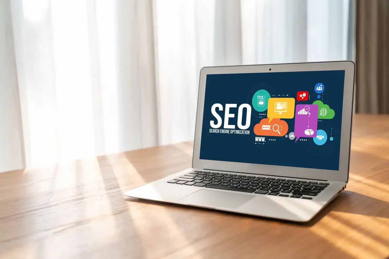 A laptop displaying a search engine optimization graphic, illustrating how SEO is the foundation for AI search visibility.