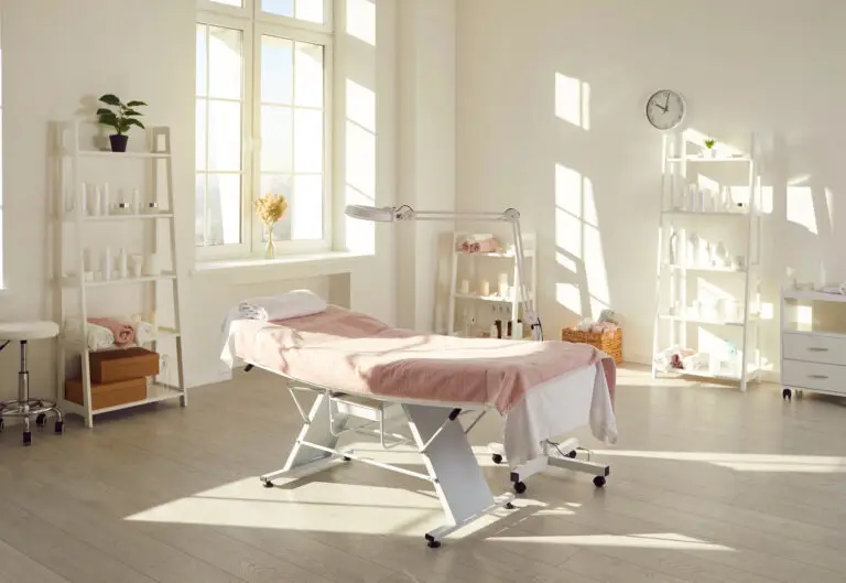 Modern med spa interior with treatment table and skincare products