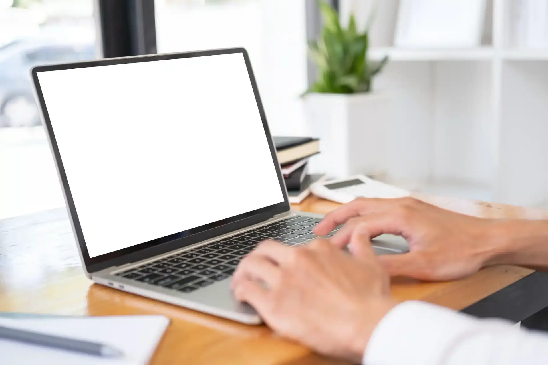 A prospective patient comparing Fort Lauderdale plastic surgery practices on a laptop