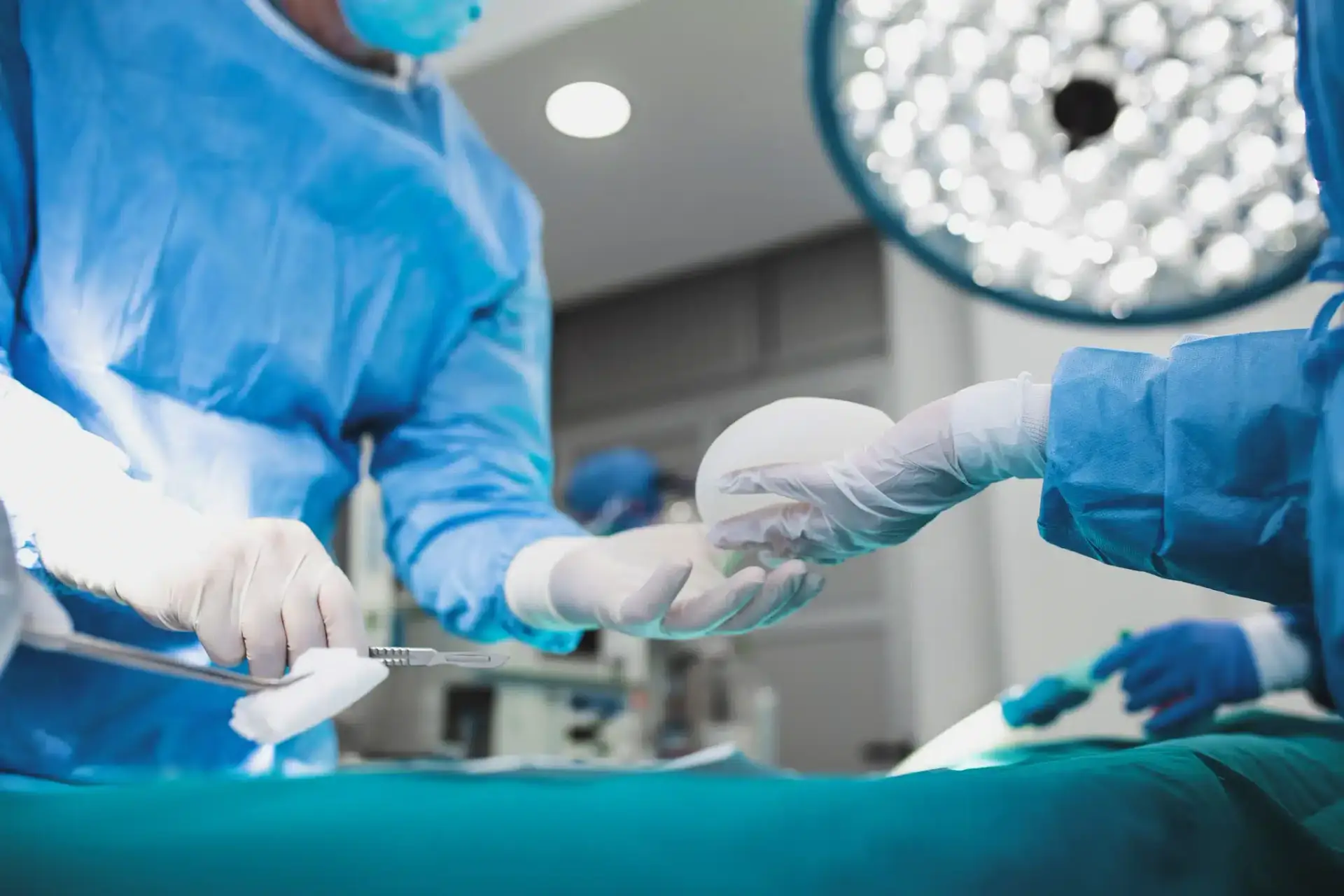 A plastic surgery team performing an operation in an accredited South Florida operating room