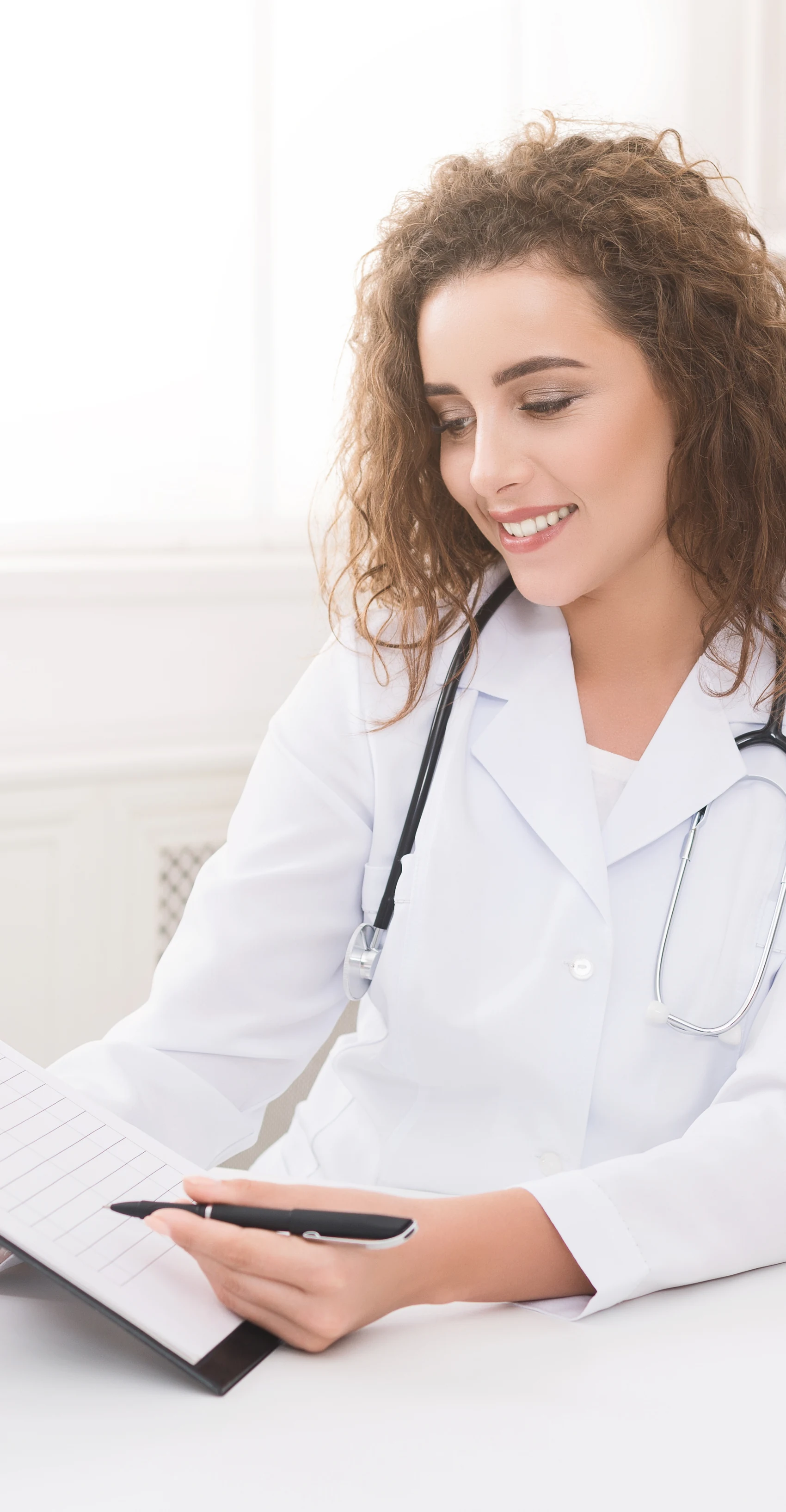 A plastic surgeon consulting with a patient at a Naples, Florida practice during the winter season