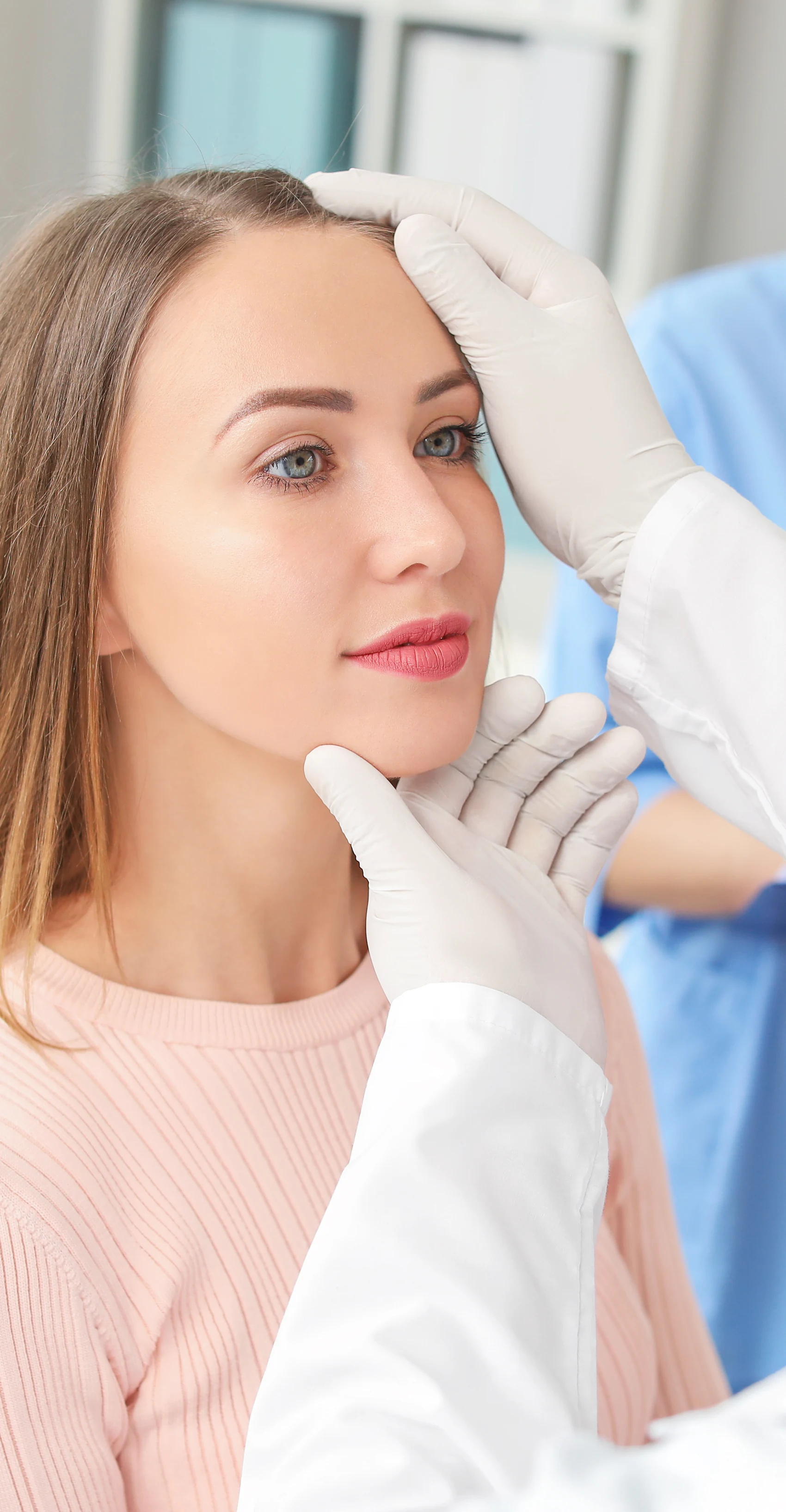 A plastic surgeon meeting with a new patient at a Sarasota area practice