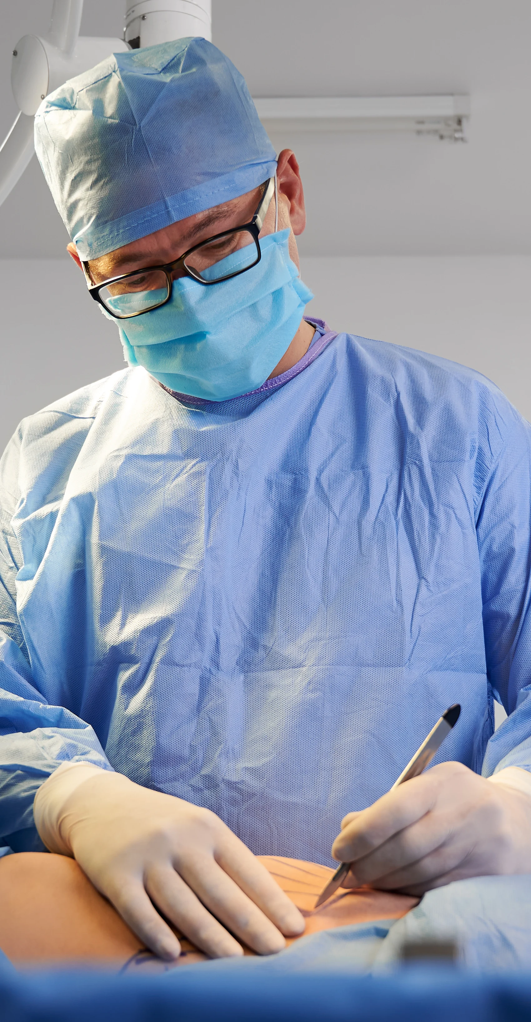 A plastic surgery team performing a procedure in an accredited Tampa Bay operating room