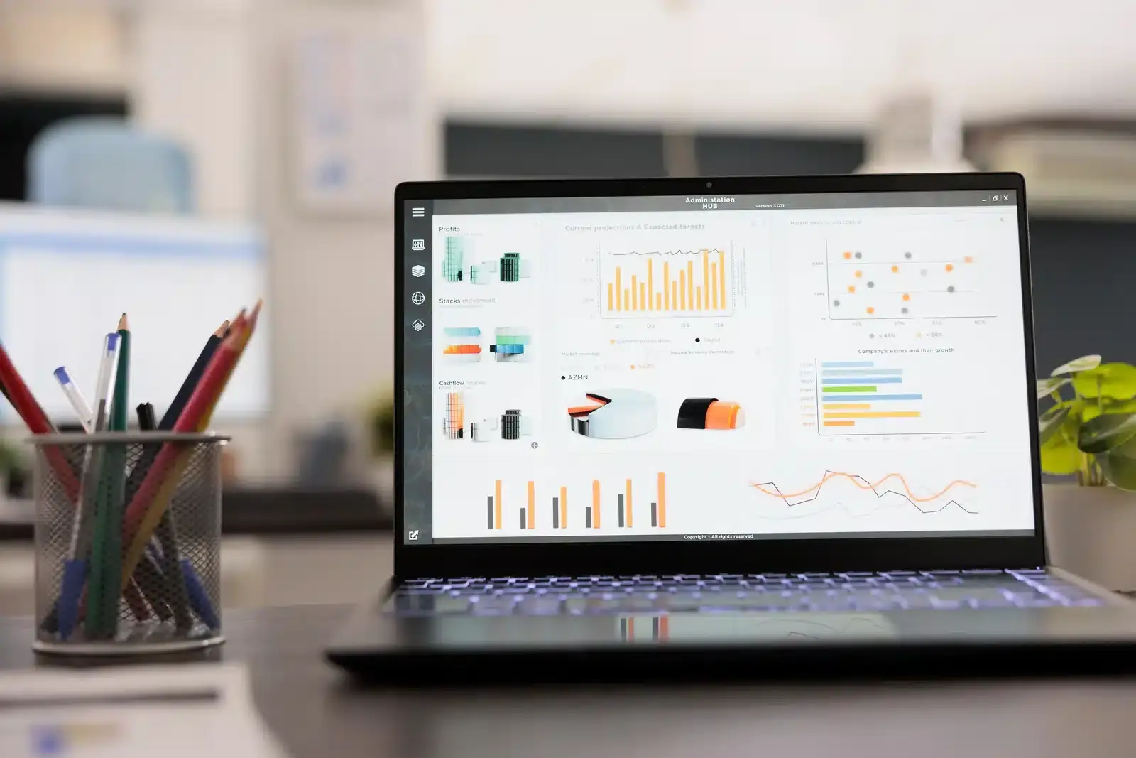 A laptop on a desk displaying a website analytics dashboard, illustrating a plastic surgery practice reviewing why its site is not ranking.